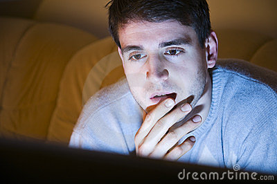 young-man-watching-television-23762549.jpg